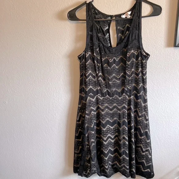 Black lace dress with tan under lining.